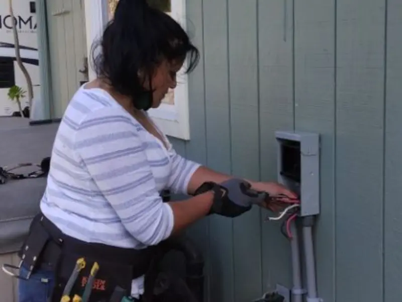 Licensed electrician wiring an exterior subpanel in Waterloo